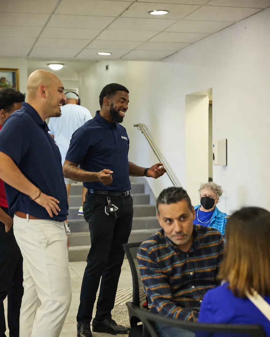 The ParkByPlate team on site with leasing office staff during an implementation.